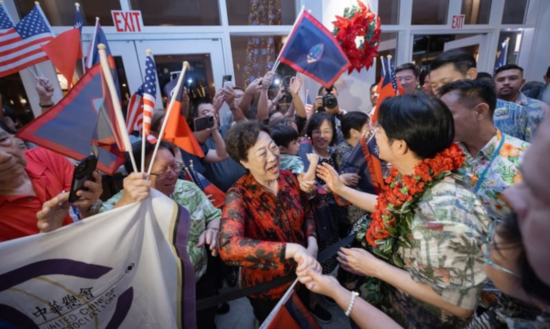 Taiwan’s President Lai Ching-te (C-R) is greeted by members of the local Taiwanese community at the Hyatt Regency in Tumon, Guam on Dec. 4, 2024.