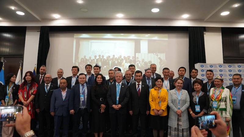 Turghunjan Alawudun (C) and his cabinet pose for a photo at the World Uyghur Congress General Assembly in Sarajevo, Bosnia and Herzegovina, Oct. 26, 2024.