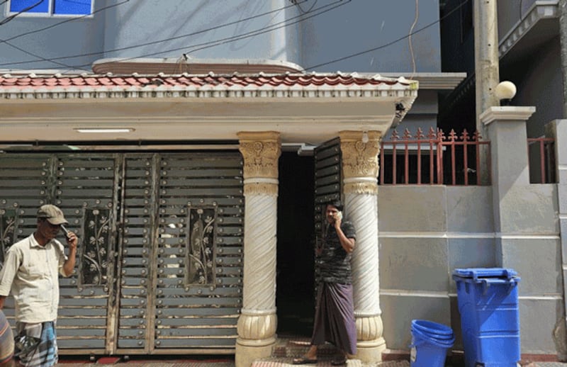 Mohammed Rafiq stands at the door of a building in Teknaf, Bangladesh, where he is now living in an apartment with his family after fleeing from Myanmar's Rakhine state, Sept. 10, 2024. (Abdur Rahman/BenarNews)