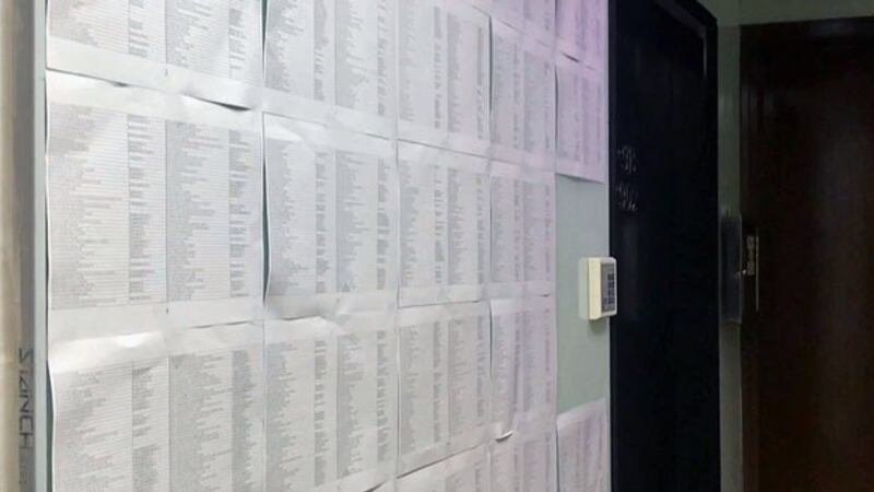 Sheets of paper tacked to the outside wall of an empty office unit in Hong Kong's Sheung Wan area in December 2018 list more than 1,800 firms that are likely shell companies using the location as their main business address. The office is just down the street from a company providing business registration services to mainland Chinese.