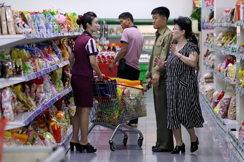 North Korean customers get assistance at a supermarket in Pyongyang, North Korea, on Sept. 12, 2018.