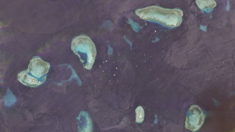 The Union Banks as of Sept. 26, 2020. Hundreds of fishing vessels are in the area at any given time, with ship-tracking data showing China's maritime militia among them. The upper left shows China's Hughes Reef, while Vietnam's Sin Cowe East outpost is visible in the lower right.